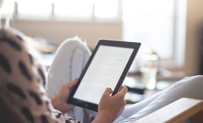 woman reading an ebook device