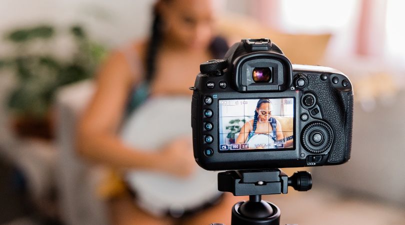 girl filming herself playing music for YouTube