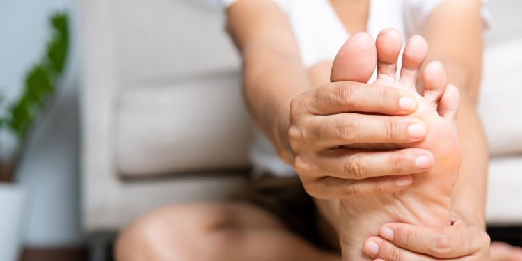 woman stretching her feet