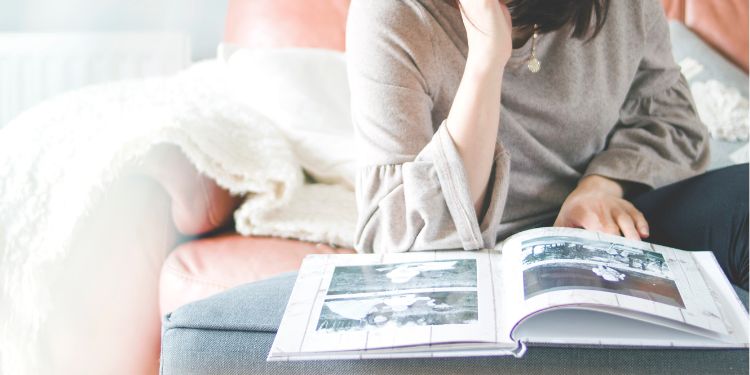 woman looking at a photo album