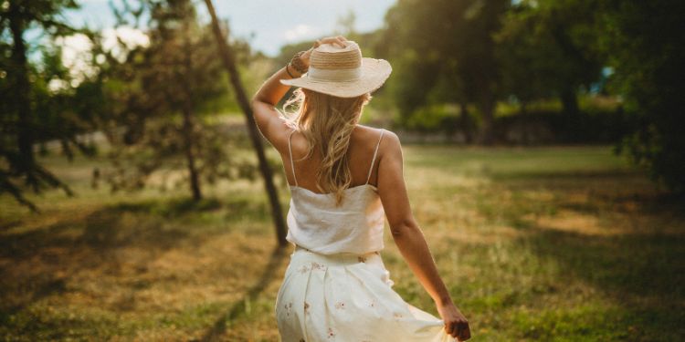 woman walking through a park outside