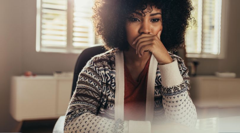 woman thinking about limiting beliefs